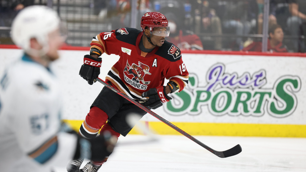 Bokondji Imama of the Arizona Coyotes stretches during warmups